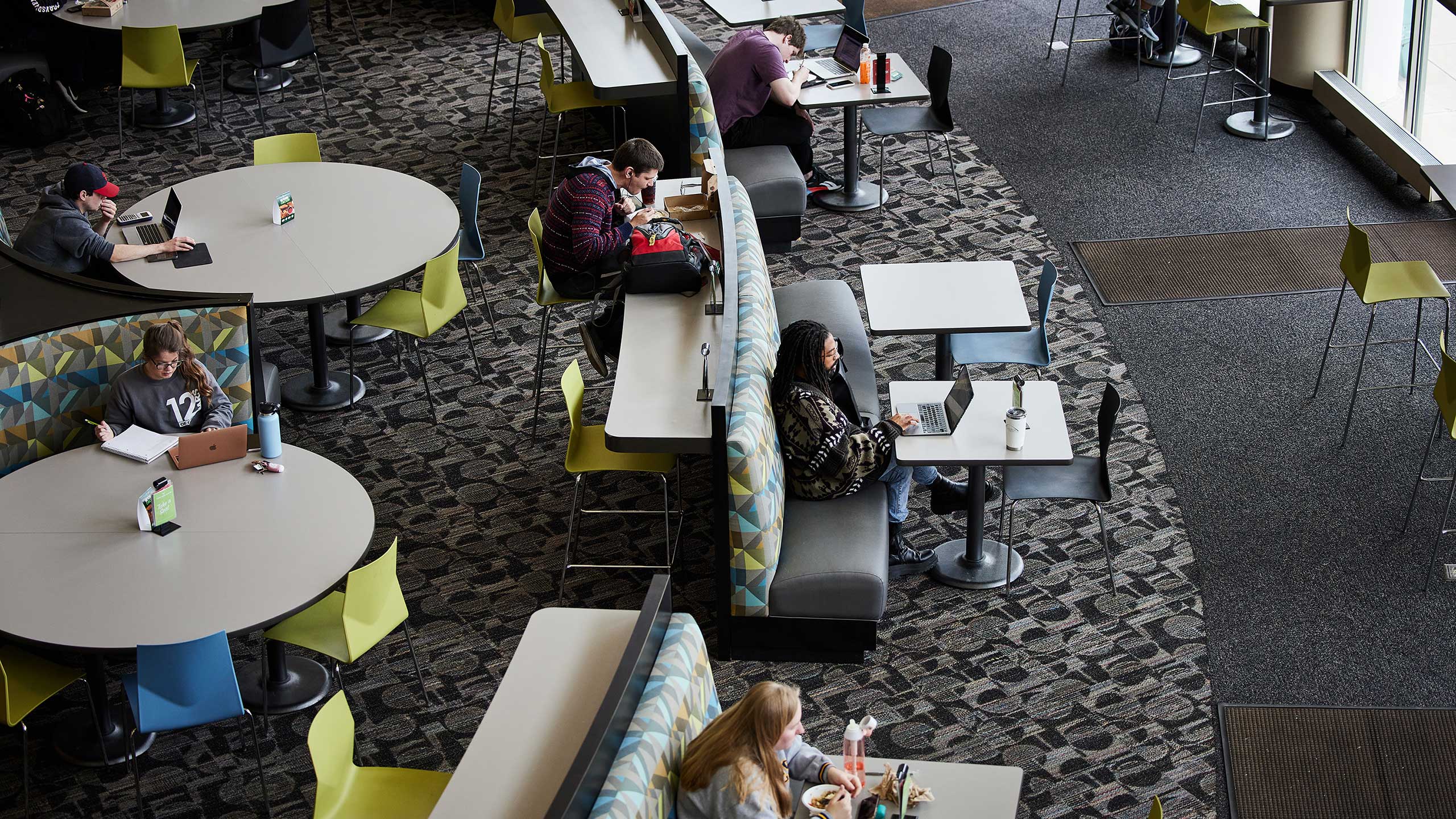 Students eating and studying in common area